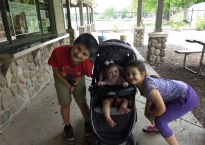 picture of our three kids together at the zoo